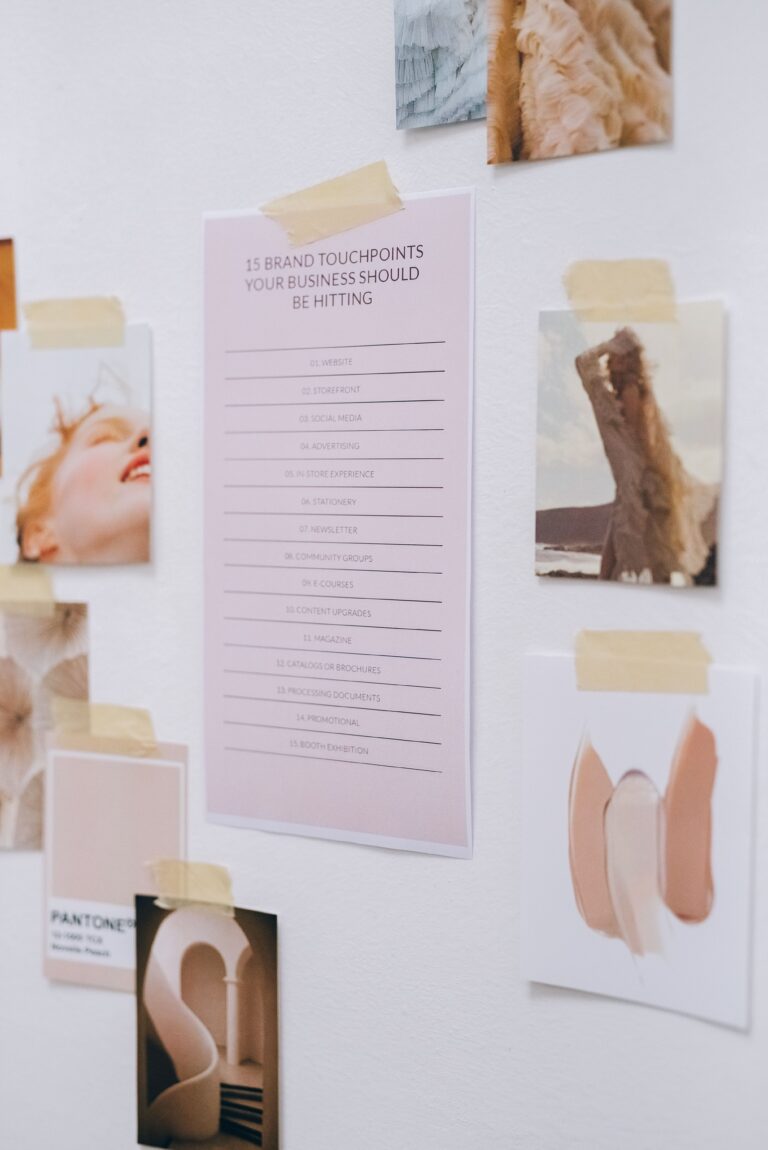 various papers relating to planning out brand strategy are taped to a wall